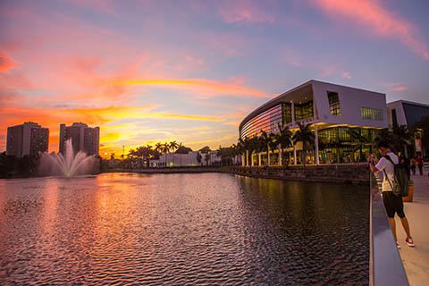 A photo of the University of Miami Shalala Student Center during  sunset.