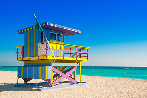 A stock photo of a lifeguard's station on the beach of Miami Beach, Florida.