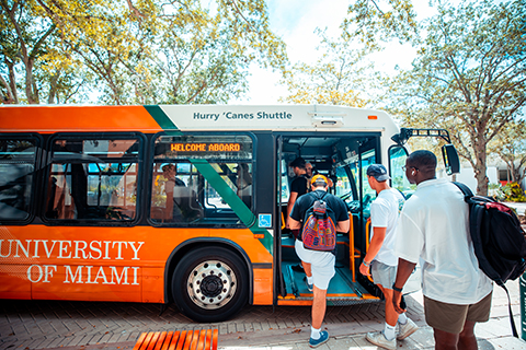 Students entering the school trolley on campus.